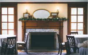 Decorative mirrors on fireplace mantlepiece